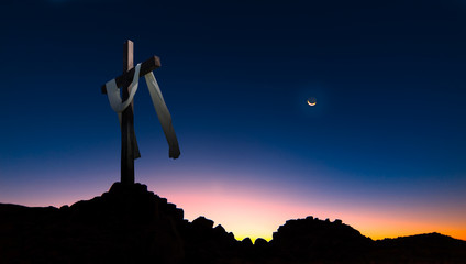 Wall Mural - Christian cross over dark sunset background panoramic view