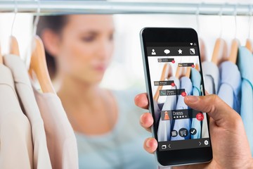 Poster - Composite image of hand holding smartphone