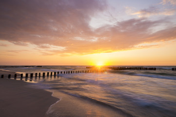 Wall Mural - sunset over the sea beach