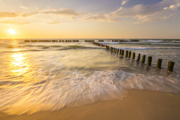 Wall Mural - sunset over the sea beach