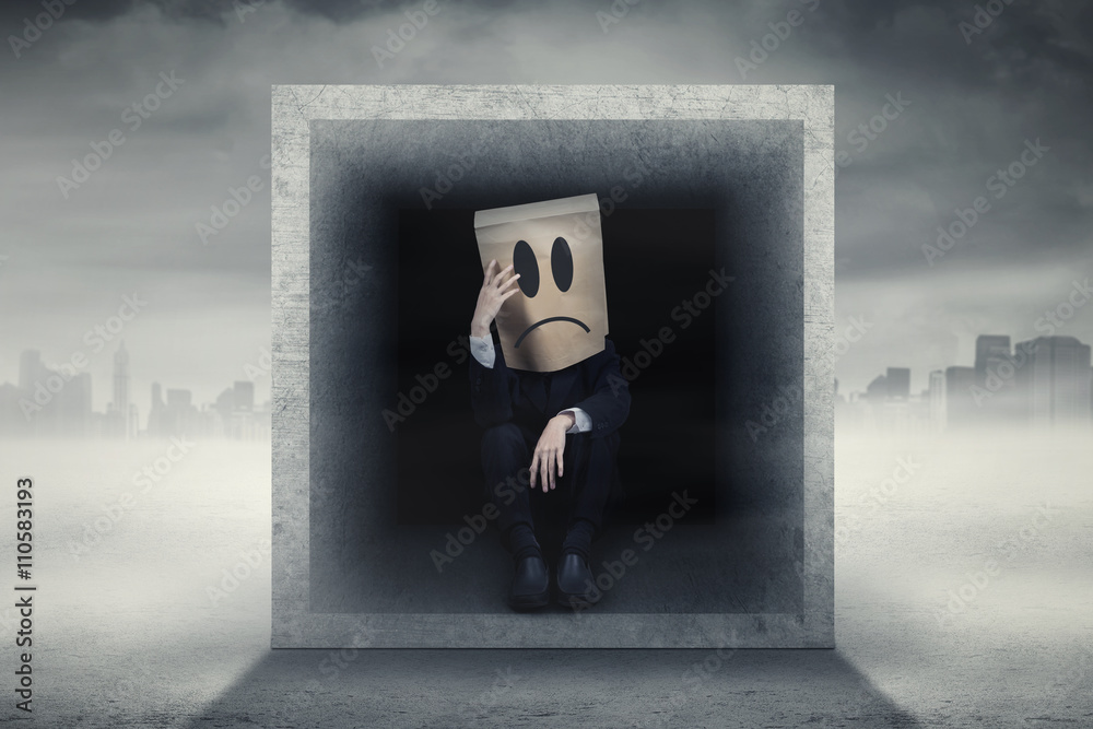 Worker sits inside a box outdoors