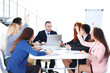 © Africa Studio - Young colleagues sitting at the business meeting in the office