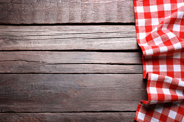 Wall Mural - Checkered napkin on wooden background