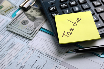 Poster - Money concept. Black calculator with cash and documents, close up