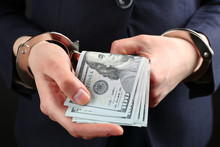 Man In Handcuffs With Money