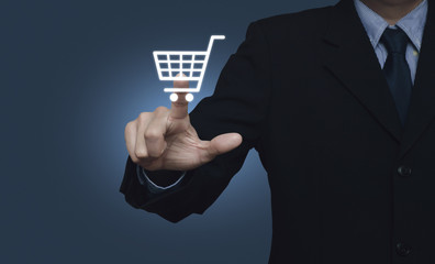 Businessman pressing shopping cart icon over blue background, Sh