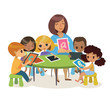 Group of Happy Children and Tiitor with tablets sitting on a desk. School lesson illustration. Preschool lesson. Contemporary education using the devices. Vector. Isolated.