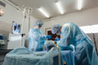 © satyrenko - Team surgeon at work in operating room.