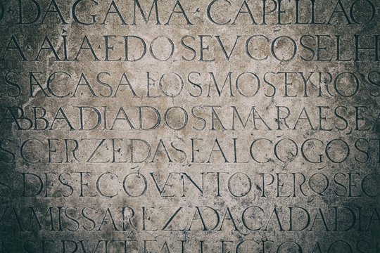 Vintage image of background of old wall with latin inscriptions