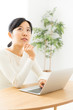 © taka - young asian woman using laptop