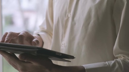 man using tablet computer touchscreen