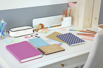 Wall Mural - Office and school set with stationery and notebooks on a table