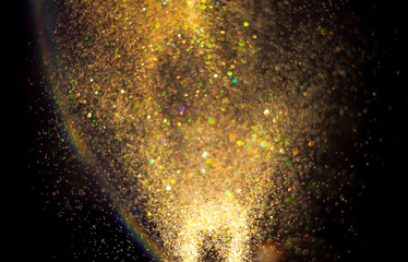 Wall Mural - gold glitter texture on a black background