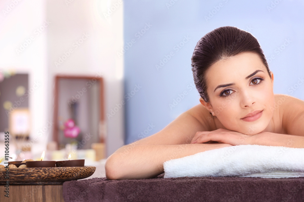 Young woman relaxing in spa salon