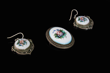 Beautiful brooch and earrings Rostov enamel on a black background