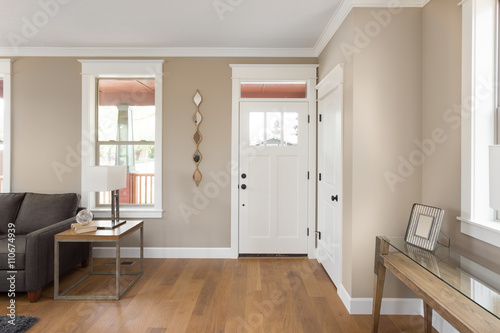 Fotografia, Obraz Foyer and entryway in new home with hardwood floors, couch, lamp