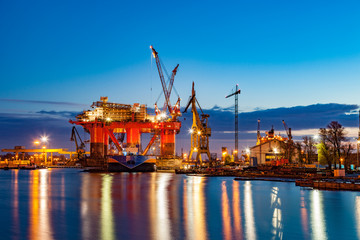 Wall Mural - Oil Rig in the shipyard for maintenance at night.