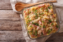 Noodles Baked With Ham And Cheese Close-up In A Baking Dish. Horizontal Top View 
