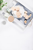 Fototapeta Mapy - Biscuits on gray plate with cups of coffee with green and white