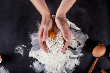 Wall Mural - Cook is making  cookies with wooden rolling pin