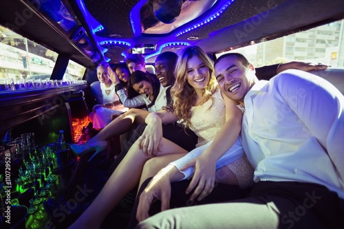 Happy friends chatting in limousine Tableau sur Toile