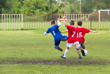 Wall Mural -  Boys kicking ball