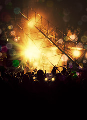 Nightlife in rock music with silhouettes and stage lights on concert.