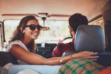 Couple in a car going on roadtrip