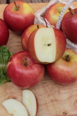 red apples is delicious on wood background.