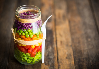 Wall Mural - Fresh vegetable salad in a mason jar