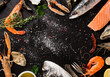 Fresh seafood on black stone.