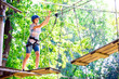 © davit85 - adventure climbing high wire park - people on course in mountain