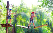 © davit85 - adventure climbing high wire park - people on course in mountain