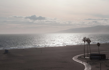 Wall Mural - The Pacific ocean during sunset. Landscape with blue sea, the mountains and the dusk sky, the USA, Santa Monica. 