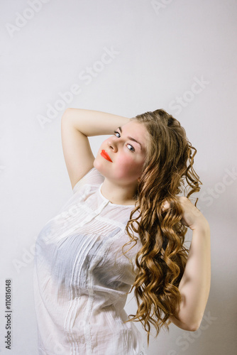 Fényképezés emotionless young woman posing on a white background
