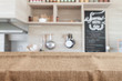 burlap on wood table top with blur kitchen background