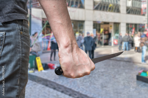 Fotografía Murderer or killer is attacking with knife n public place.