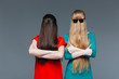 © Drobot Dean - Two funny women covered face with long hair