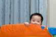 © Kenishirotie - Asian baby in playpen
