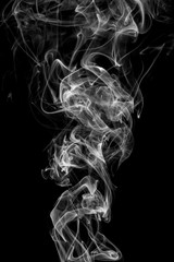 Wall Mural - White smoke, isolated on black background.