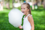 Fototapeta  - Cute girl with white cotton candy
