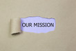 Our Mission message written under torn Brown paper