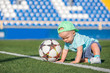 Kid with Ball on a football field