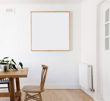 Blank Framed Print On White Wall In Danish Styled Interior Dinin