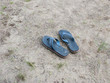 © Connect Images - A pair of flip flops on a beach