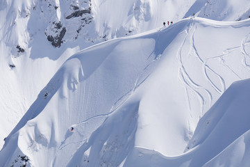 Wall Mural - Snowboard freeride, snowboarders and tracks on a mountain slope. Extreme winter sport.