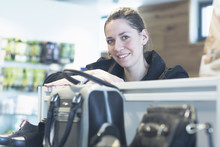 Portrait Of Female Sales Assistant In Shoe Shop