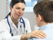 © Connect Images - Doctor comforting young boy in clinic