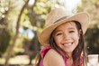 © Connect Images - Portrait of cute smiling girl wearing straw hat