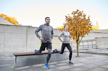 Poster - couple doing lunge exercise on city street